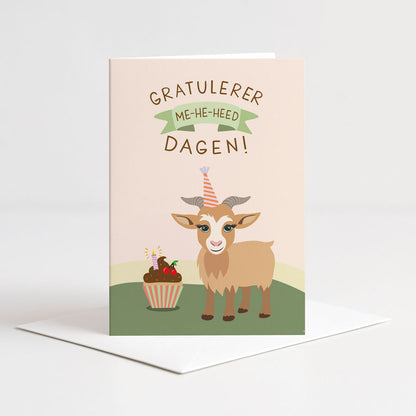 Dobbelt bursdagskort fra Holloi med illustrasjon av en geit i festhatt ved siden av en cupcake, og teksten 'GRATULERER ME-HE-HEED DAGEN!