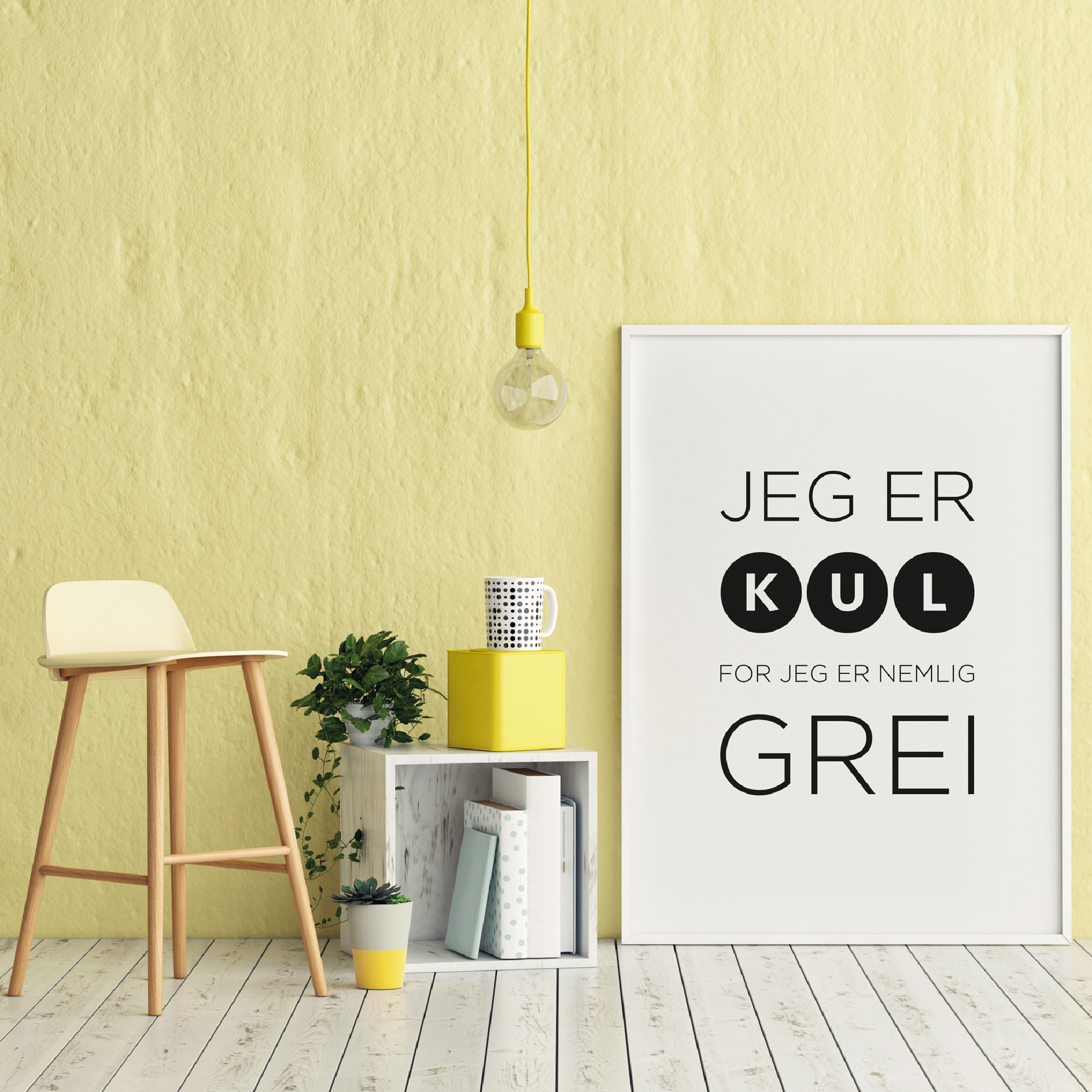 Plakat med tekst med det oppmuntrende budskapet "Det er kult å være grei", stående langs en gul vegg